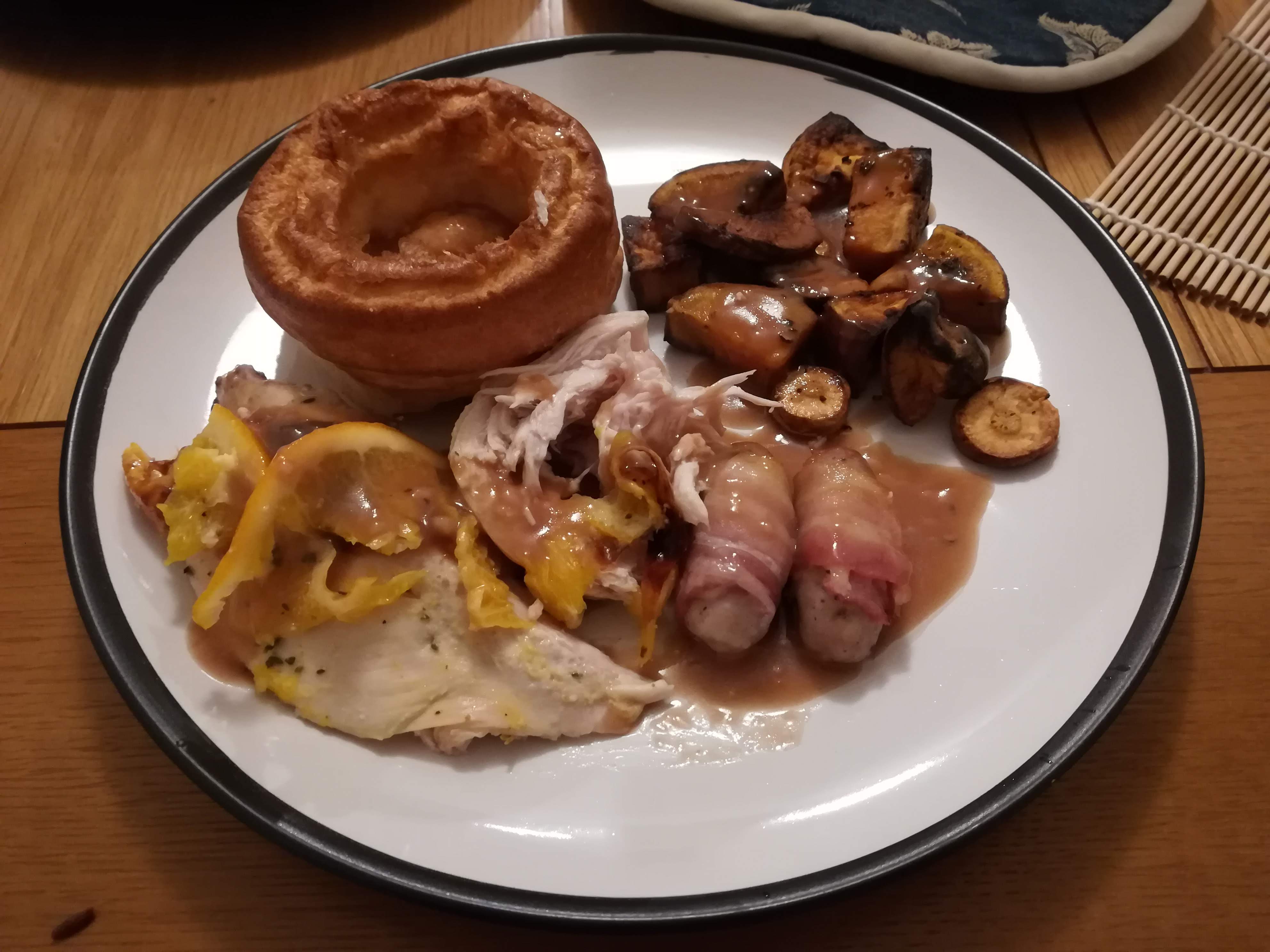 Yorshire pudding, pigs in blankets, roasted vegetables and roasted turkey with orange